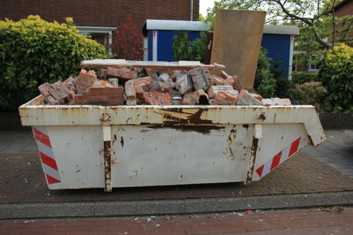 Enclosed skip on a residential property in Herne Hill