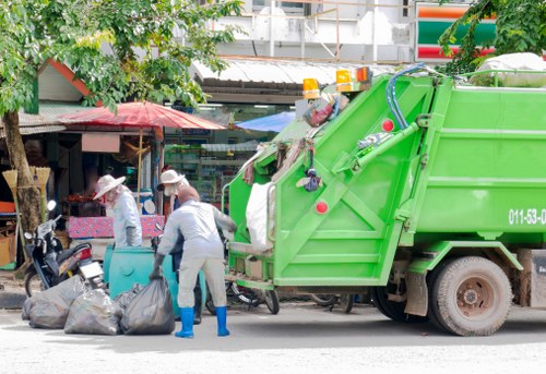 Supervisor conducting a site risk assessment before placing a skip