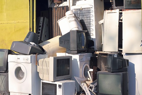 Waste being loaded into a lockable skip